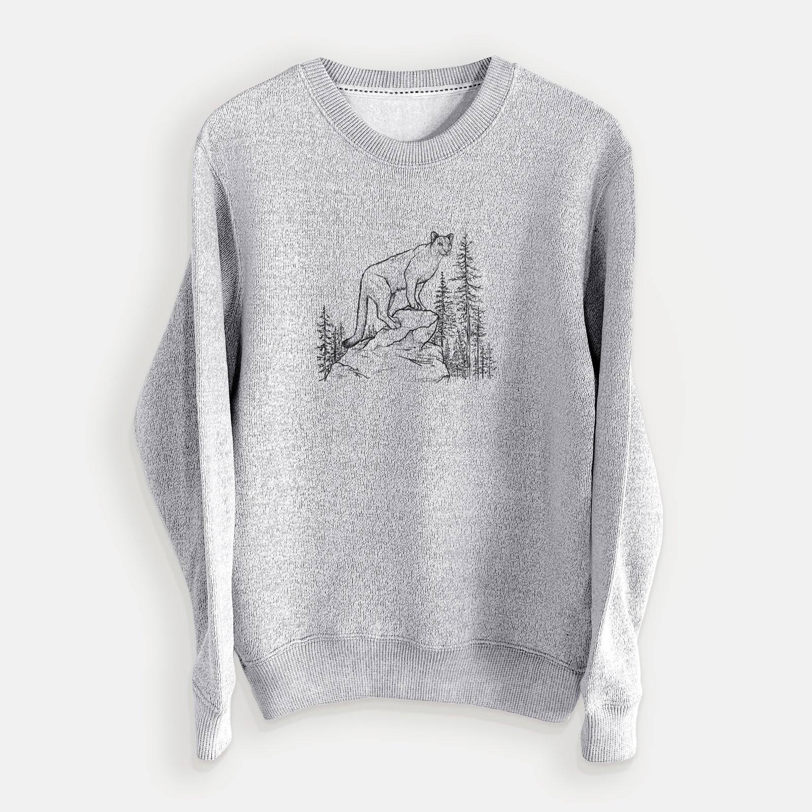 Salt and pepper knit sweatshirt laid flat, printed with a black ink illustration of a mountain lion standing on a rocky ledge among pine trees.