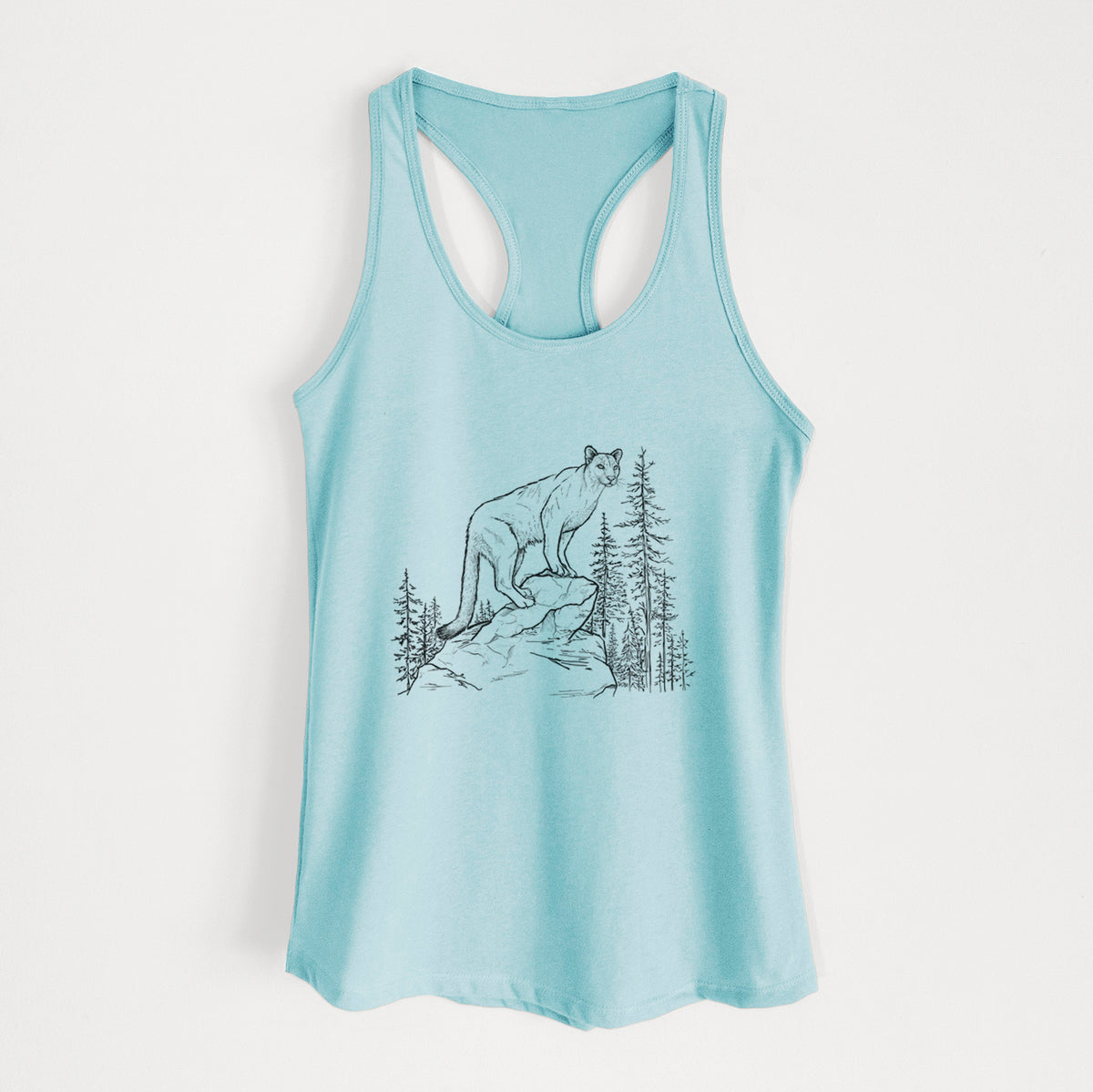 Cancun blue women's racerback tank top laid flat, printed with a black ink illustration of a mountain lion standing on a rocky ledge among pine trees.