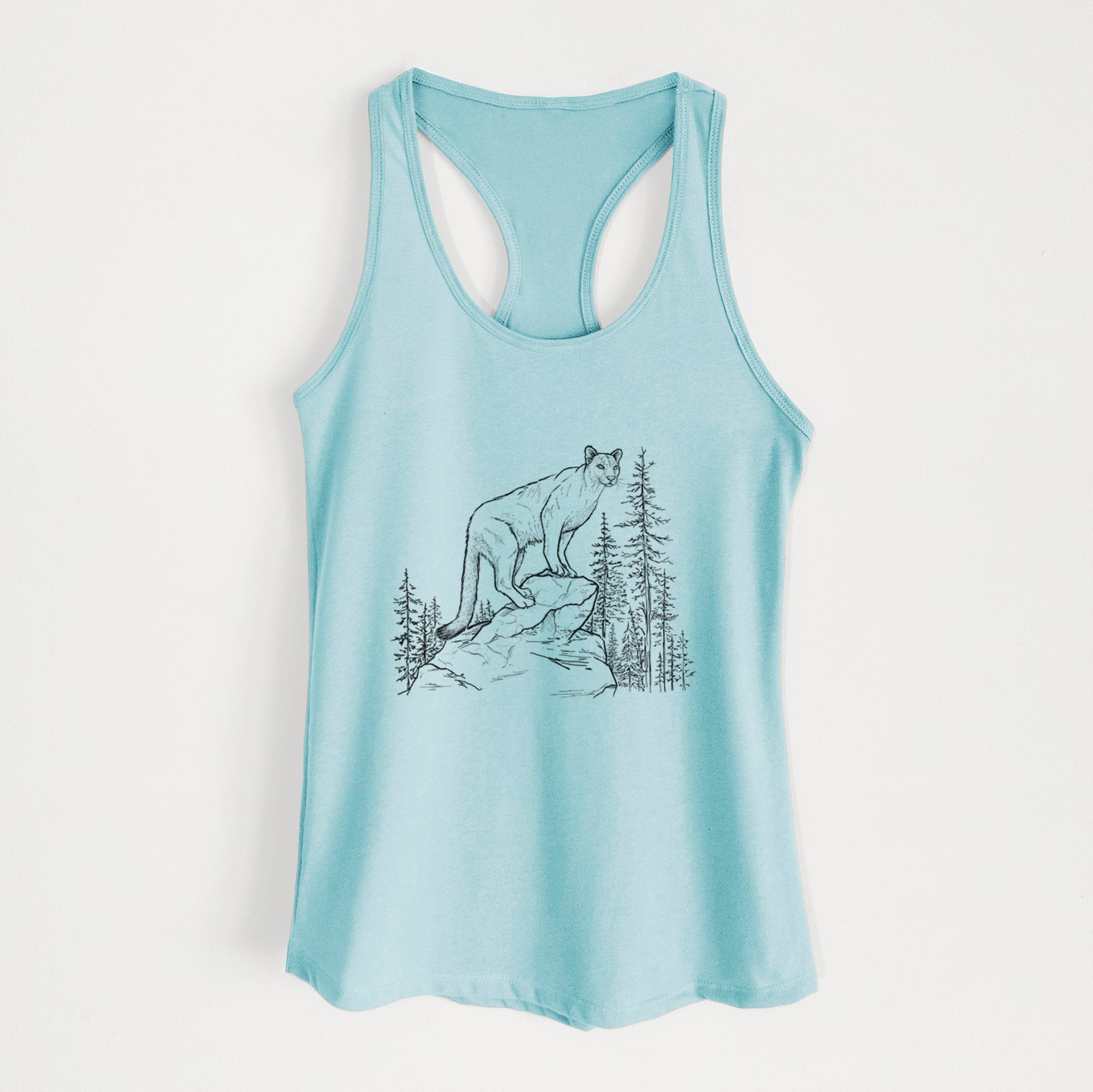 Banana cream women's racerback tank top laid flat, printed with a black ink illustration of a mountain lion standing on a rocky ledge among pine trees.