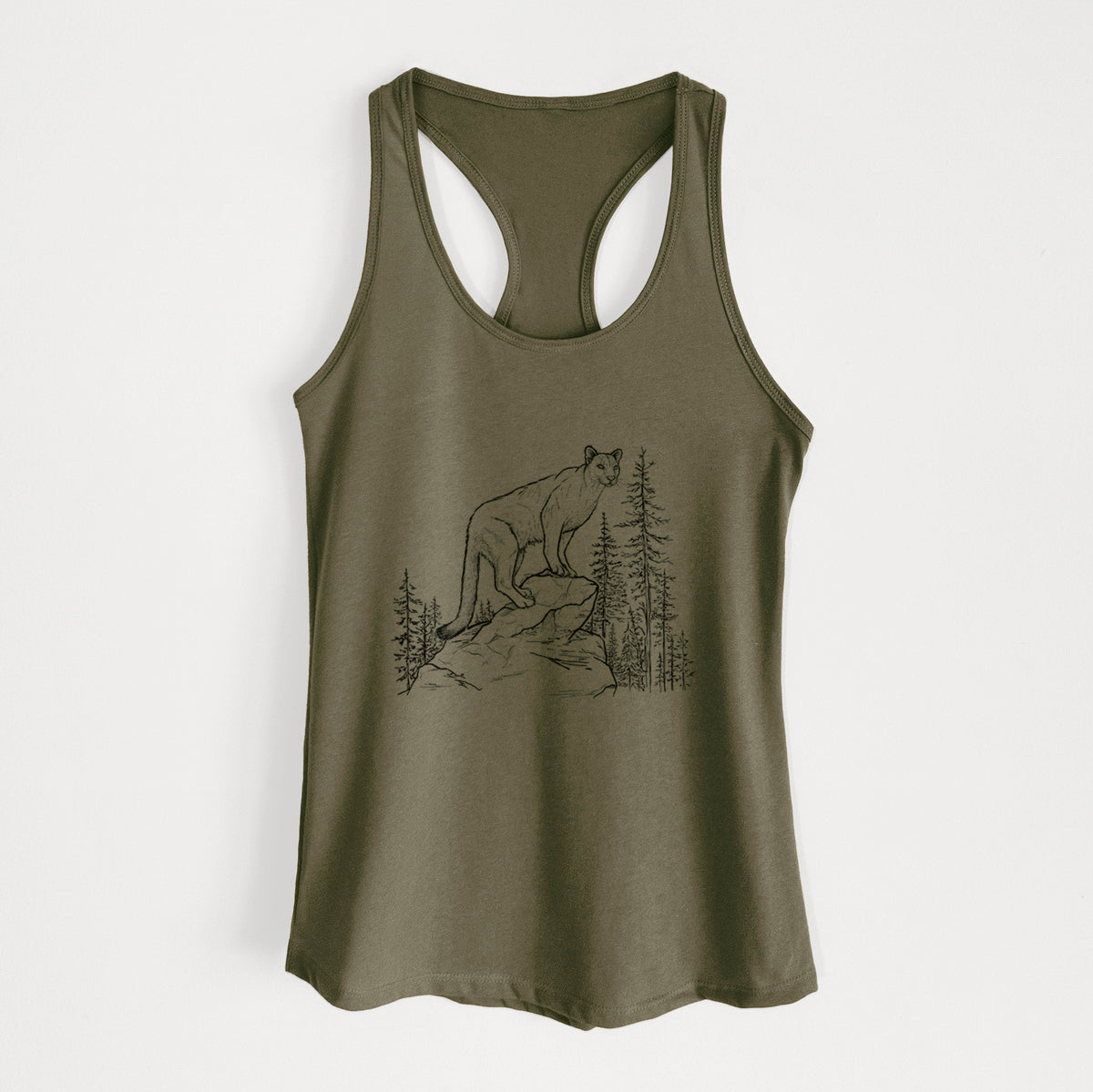 Military green women's racerback tank top laid flat, printed with a black ink illustration of a mountain lion standing on a rocky ledge among pine trees.