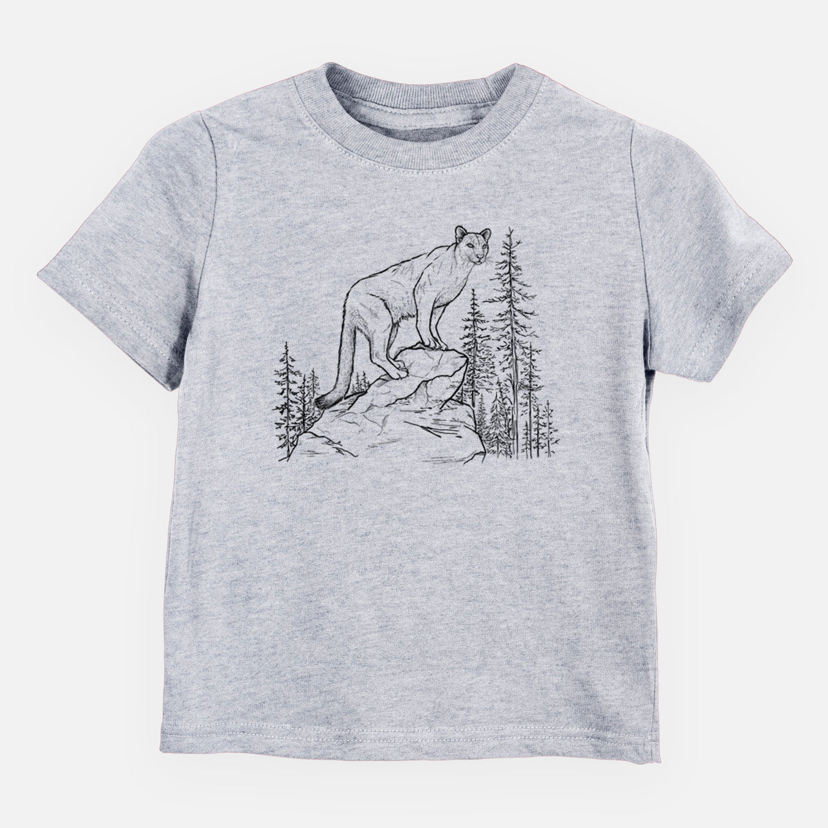 Heather grey toddler t-shirt laid flat, printed with a black ink illustration of a mountain lion standing on a rocky ledge among pine trees.