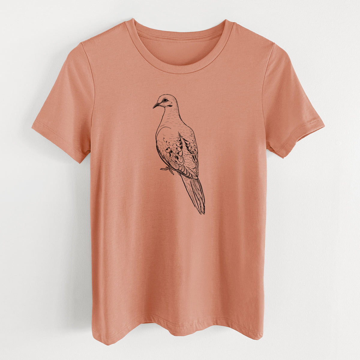 Terracotta orange women's relaxed fit cotton t-shirt laid flat, printed with a detailed black ink sketch of a mourning dove perched.