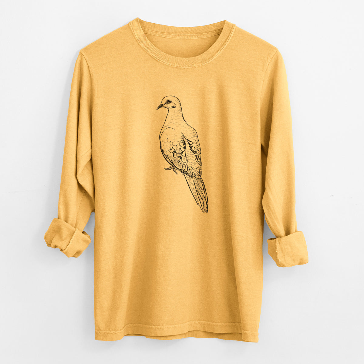 Golden wheat yellow Comfort Colors long sleeve shirt laid flat with the cuffs rolled, printed with a detailed black ink sketch of a mourning dove perched.