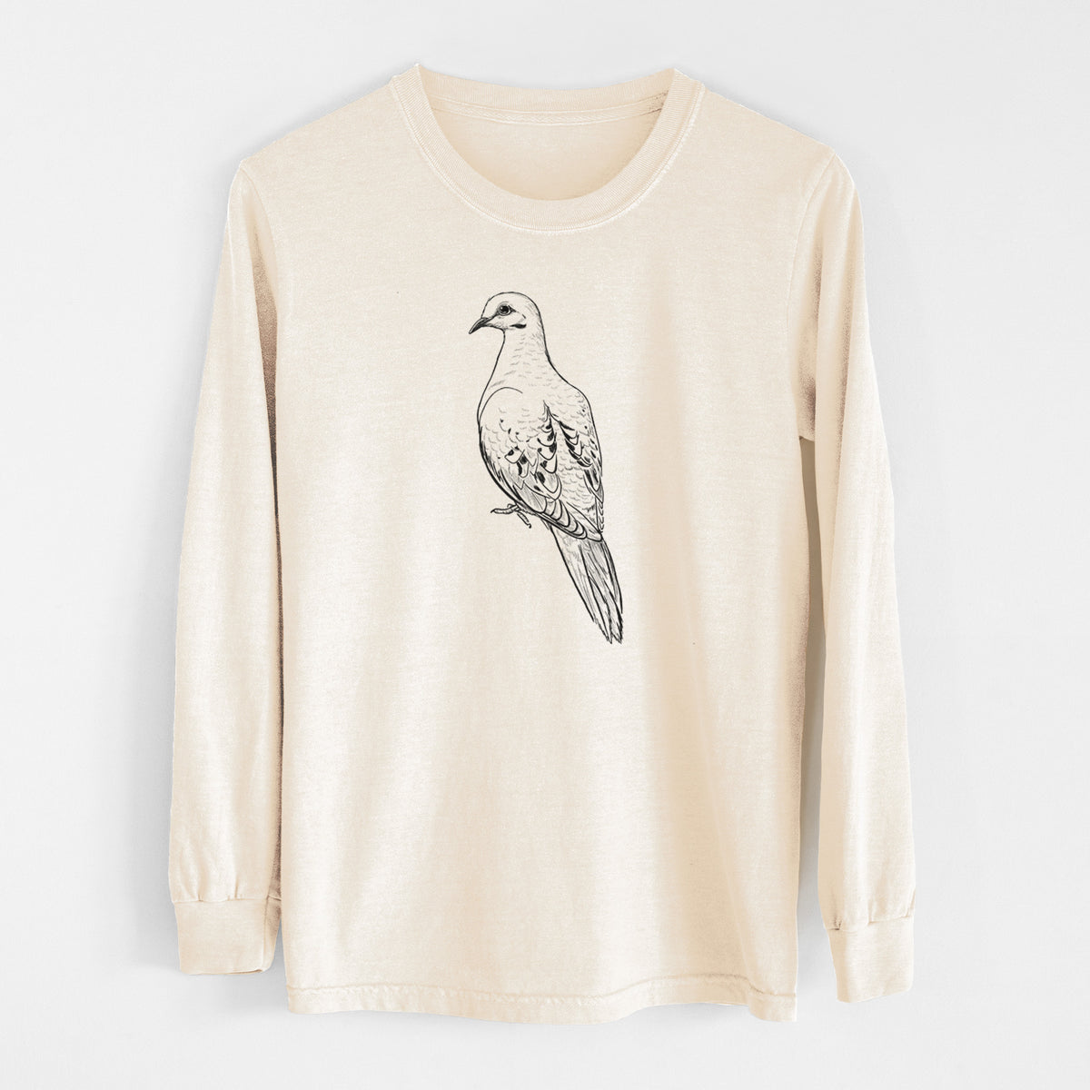 Ivory Comfort Colors long sleeve shirt laid flat, printed with a detailed black ink sketch of a mourning dove perched.