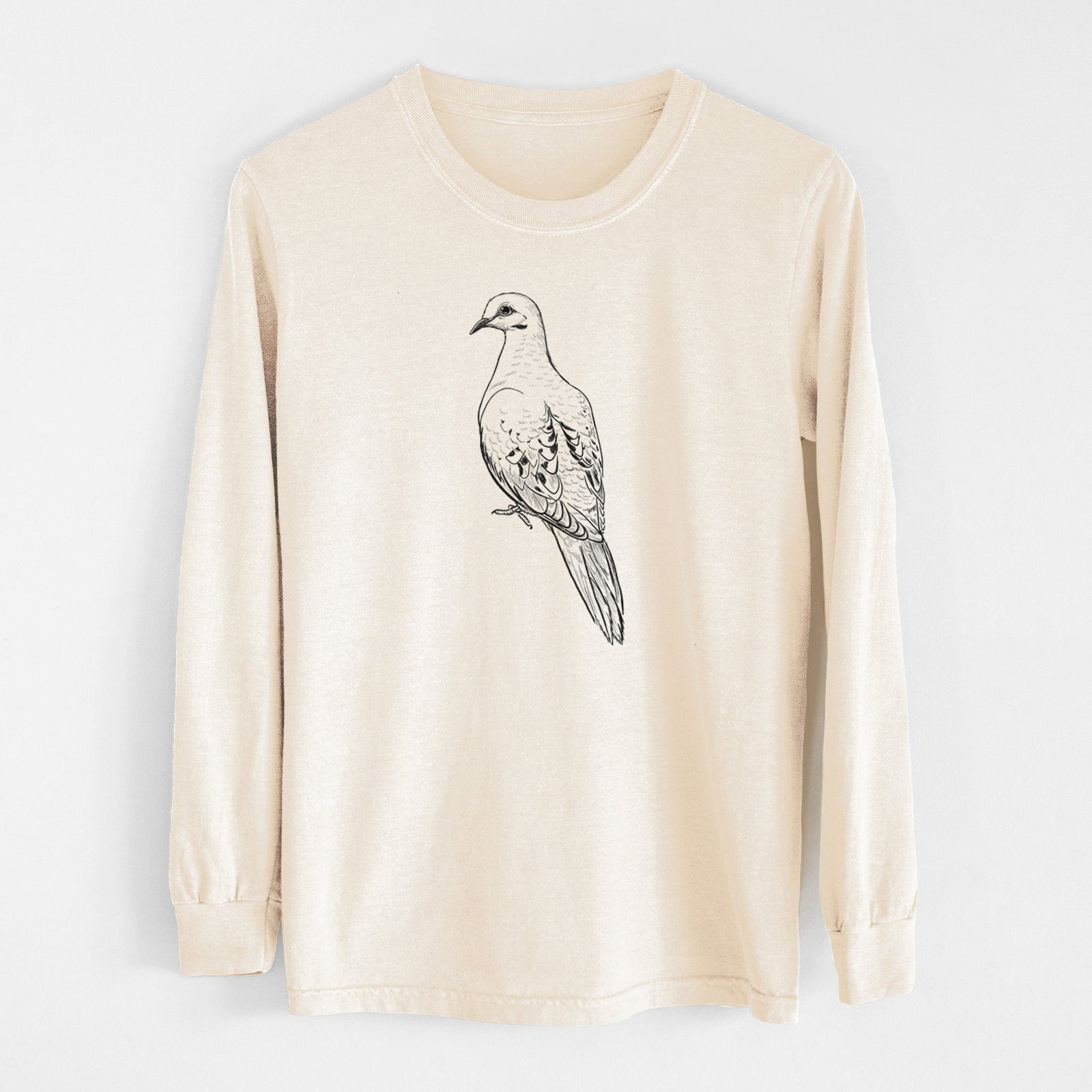 Ivory Comfort Colors long sleeve shirt laid flat, printed with a detailed black ink sketch of a mourning dove perched.