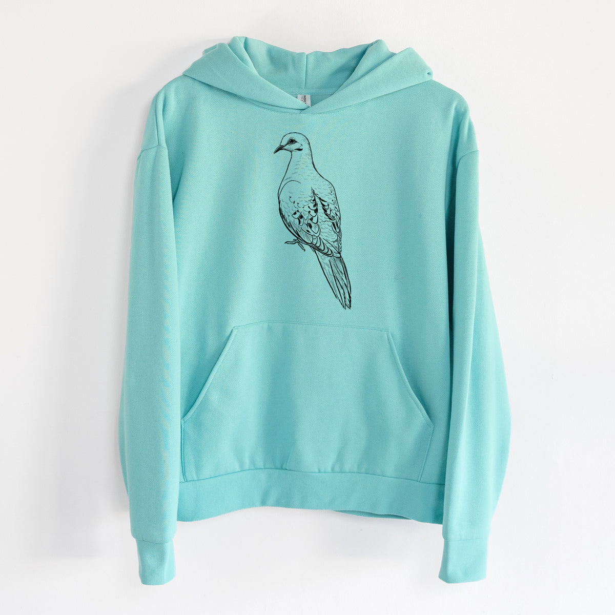 Mourning Dove - Zenaida macroura - Statement Midweight Hoodie in Seafoam, hanging on a white wall, with a front kangaroo pocket and no drawcords.