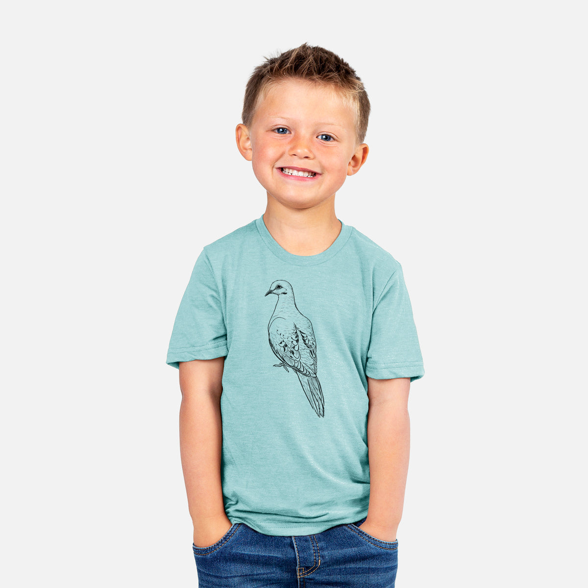Smiling boy wearing a youth t-shirt printed with a detailed black ink sketch of a mourning dove perched.