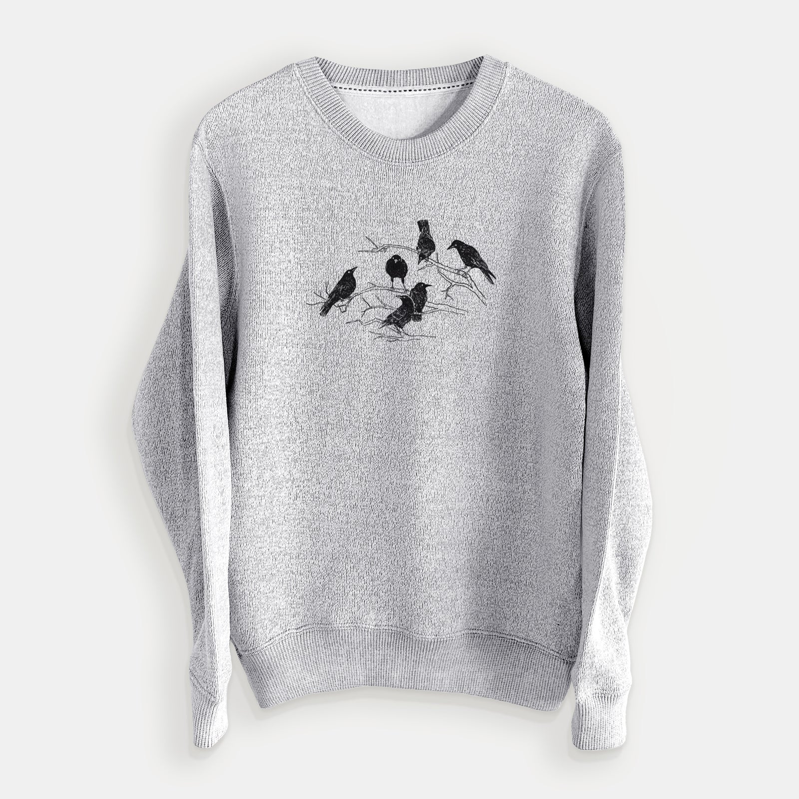 Salt and pepper knit sweatshirt laid flat, printed with a black ink illustration of a group of crows perched on bare branches.