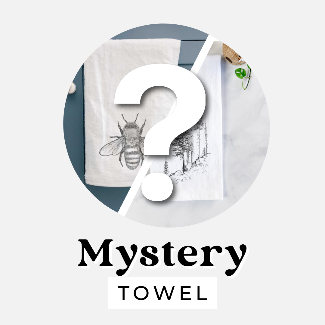 Mystery towel: white kitchen tea towels printed with black ink honey bee and nature illustrations behind a question mark.