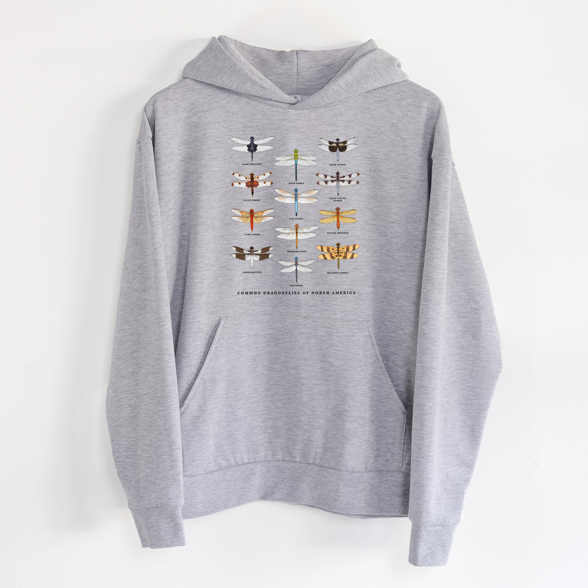 Common Dragonflies of North America - Statement Midweight Hoodie in Heather Grey, hanging on a white wall, with a front kangaroo pocket and no drawcords.