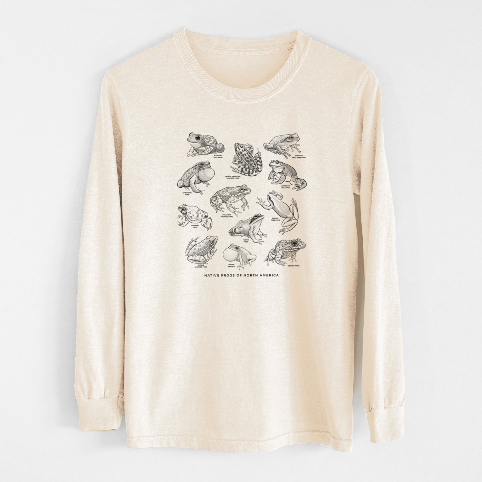 Ivory Comfort Colors long sleeve shirt laid flat, printed with a chart of black ink illustrations of North American frog species.