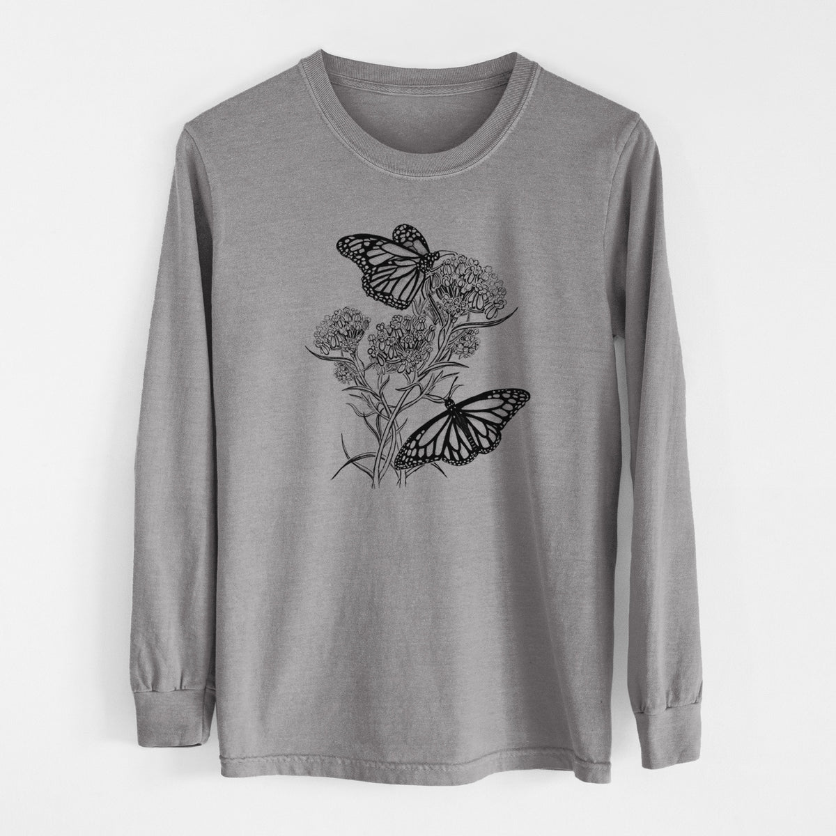 Grey Comfort Colors long sleeve shirt laid flat, printed with a black ink illustration of two monarch butterflies on flowering milkweed.