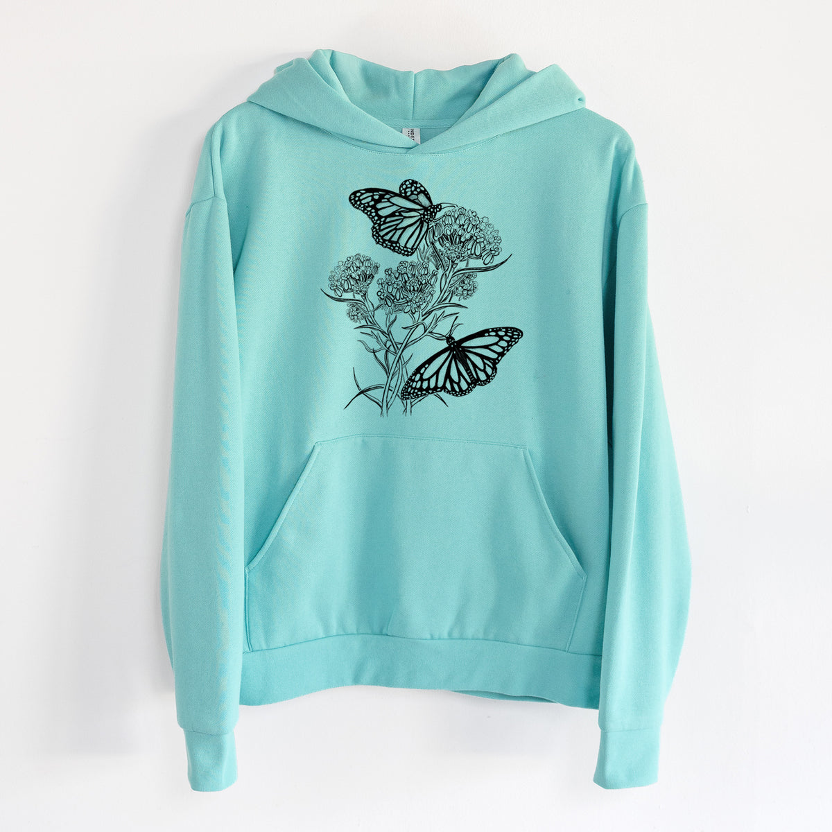 Narrowleaf Milkweed with Monarchs - Statement Midweight Hoodie in Seafoam, hanging on a white wall, with a front kangaroo pocket and no drawcords.