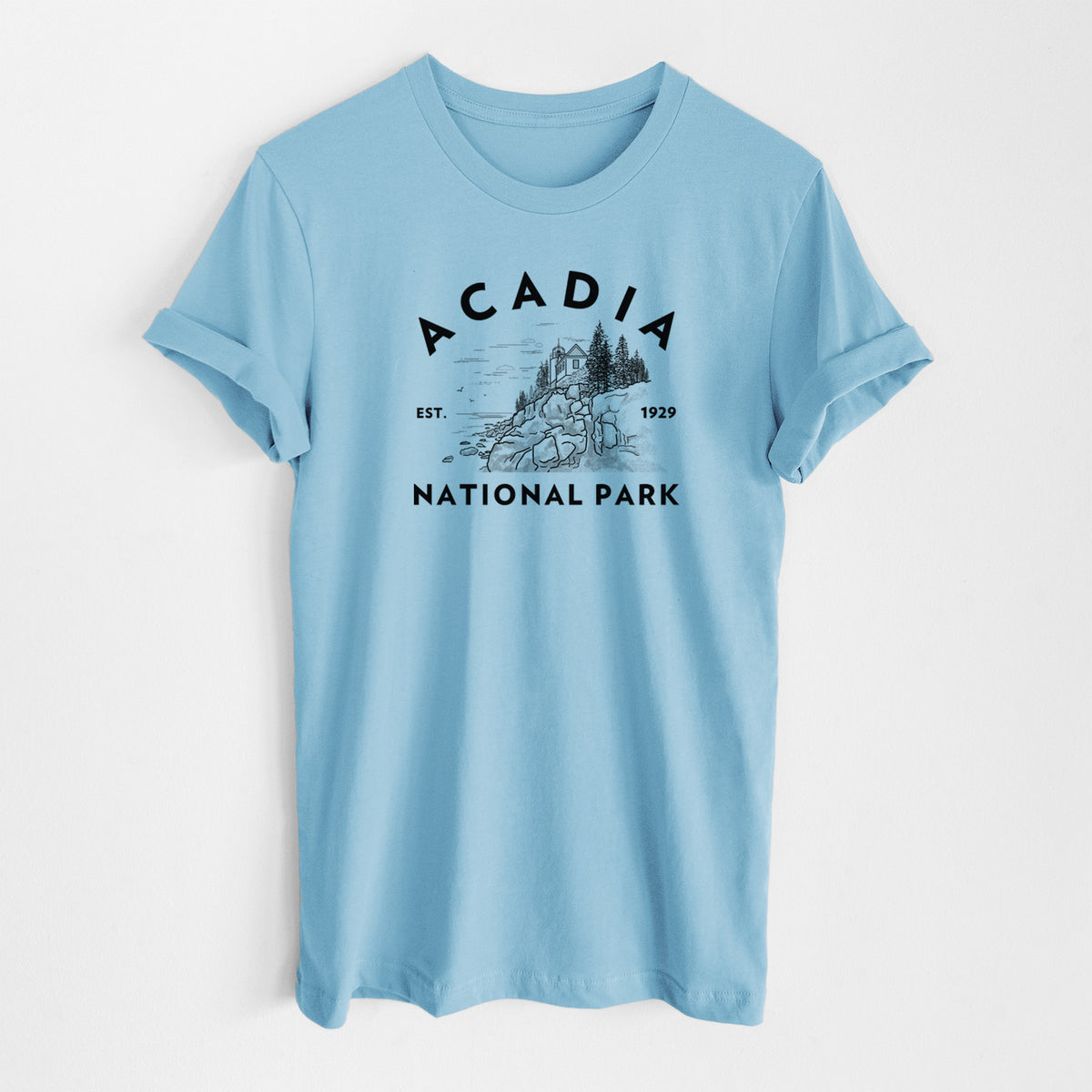 Ocean blue lightweight cotton t-shirt laid flat, printed with a round badge of a rocky coastline and pine trees, with the words Acadia National Park, Est. 1929.