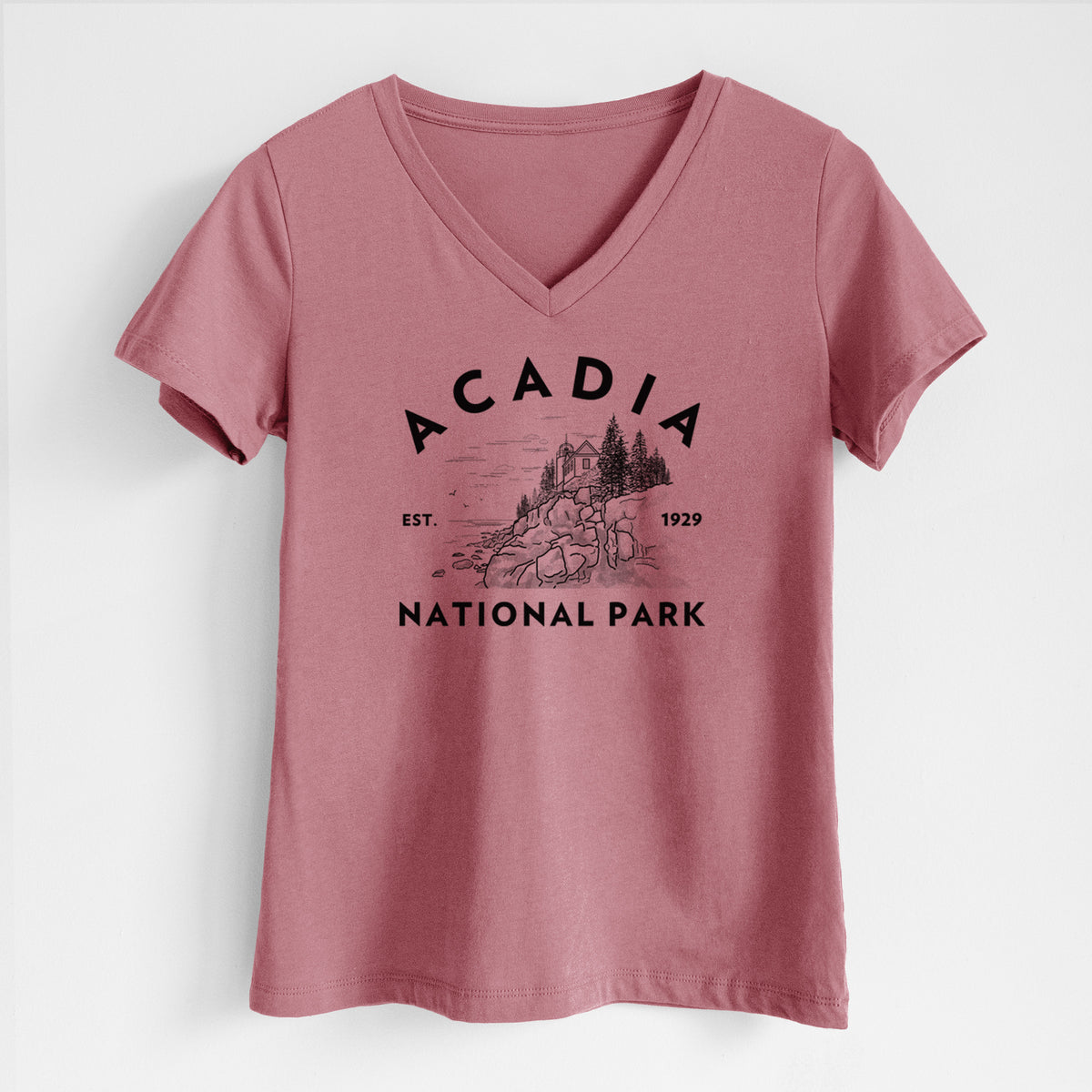 Mauve pink women's relaxed fit cotton V-neck t-shirt laid flat, printed with a round badge of a rocky coastline and pine trees, with the words Acadia National Park, Est. 1929.