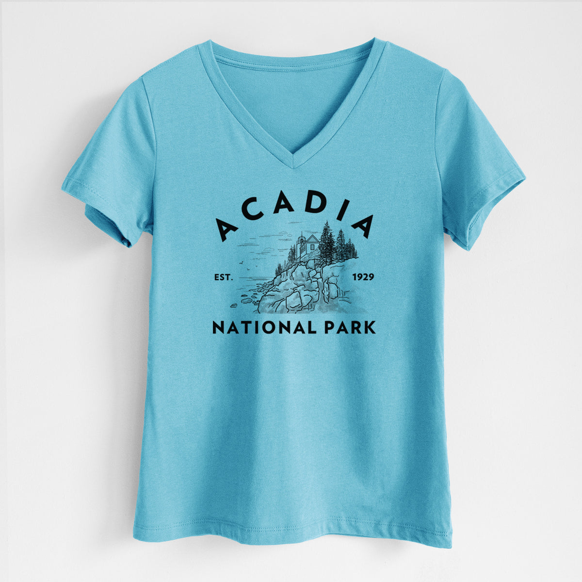Turquoise women's relaxed fit cotton V-neck t-shirt laid flat, printed with a round badge of a rocky coastline and pine trees, with the words Acadia National Park, Est. 1929.