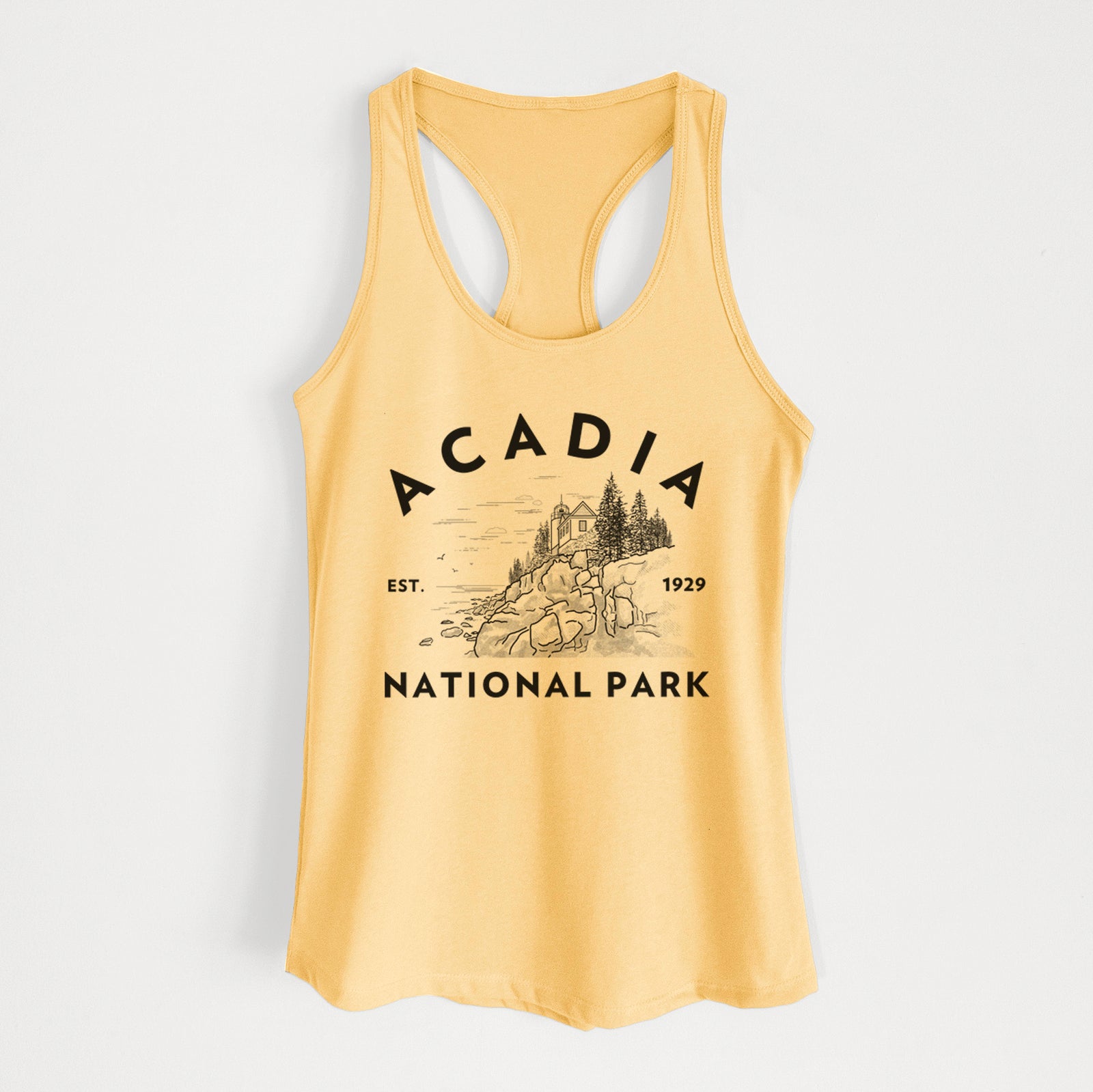 Banana cream women's racerback tank top laid flat, printed with a round badge of a rocky coastline and pine trees, with the words Acadia National Park, Est. 1929.
