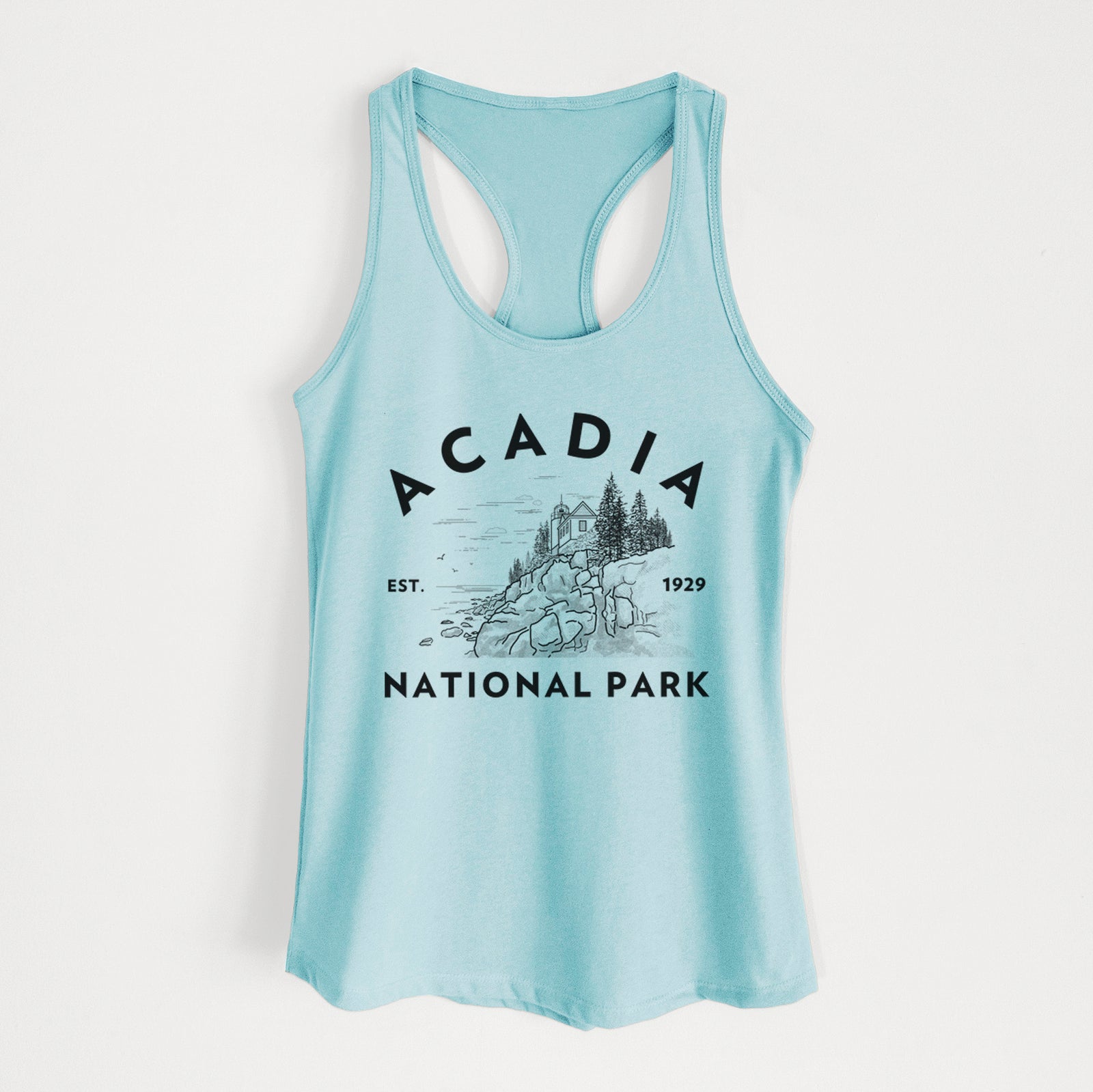 Banana cream women's racerback tank top laid flat, printed with a round badge of a rocky coastline and pine trees, with the words Acadia National Park, Est. 1929.