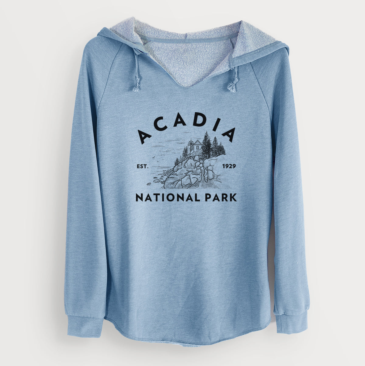 Misty blue women's Cali Wave hooded sweatshirt laid flat, printed with a round badge of a rocky coastline and pine trees, with the words Acadia National Park, Est. 1929.