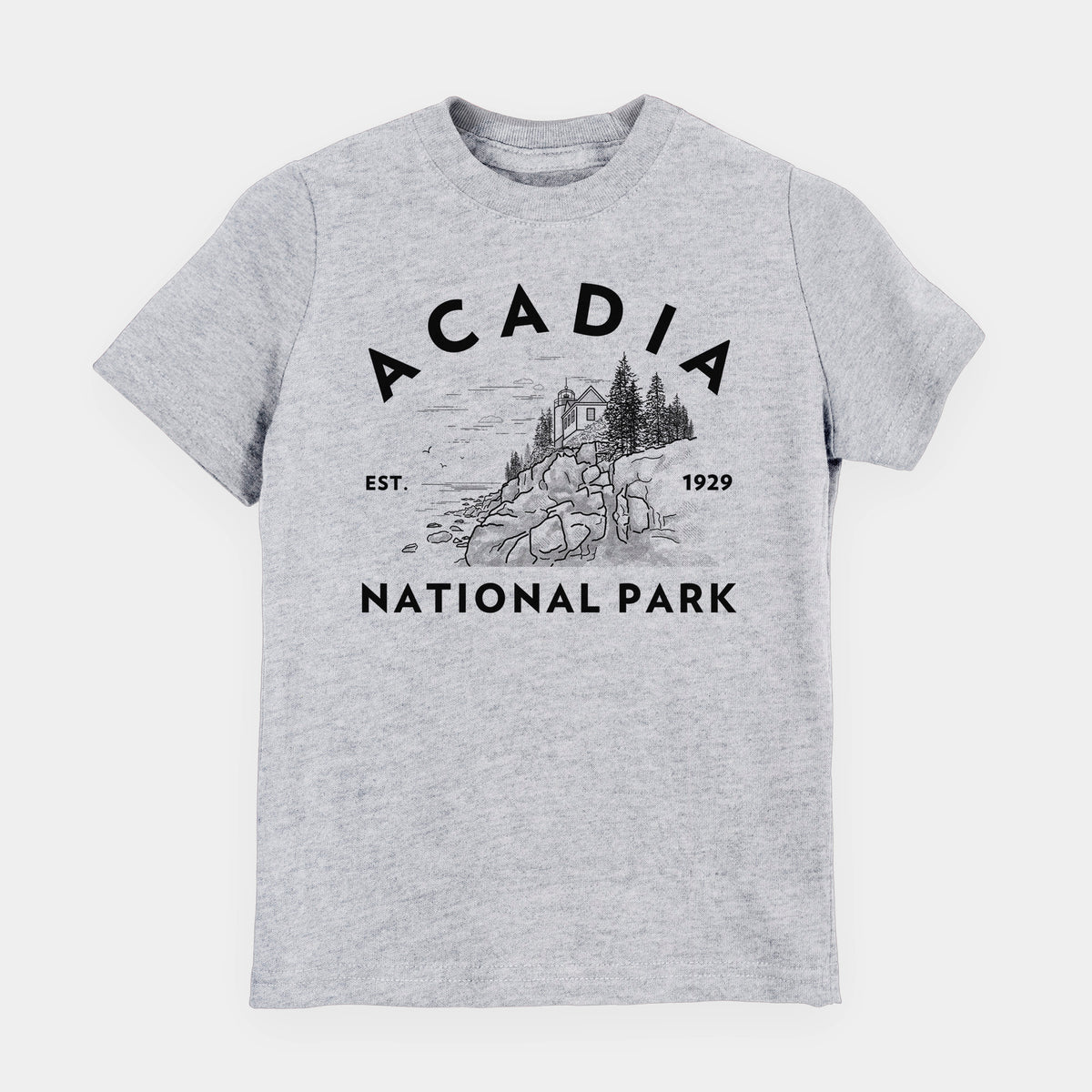 Heather grey youth t-shirt laid flat, printed with a round badge of a rocky coastline and pine trees, with the words Acadia National Park, Est. 1929.