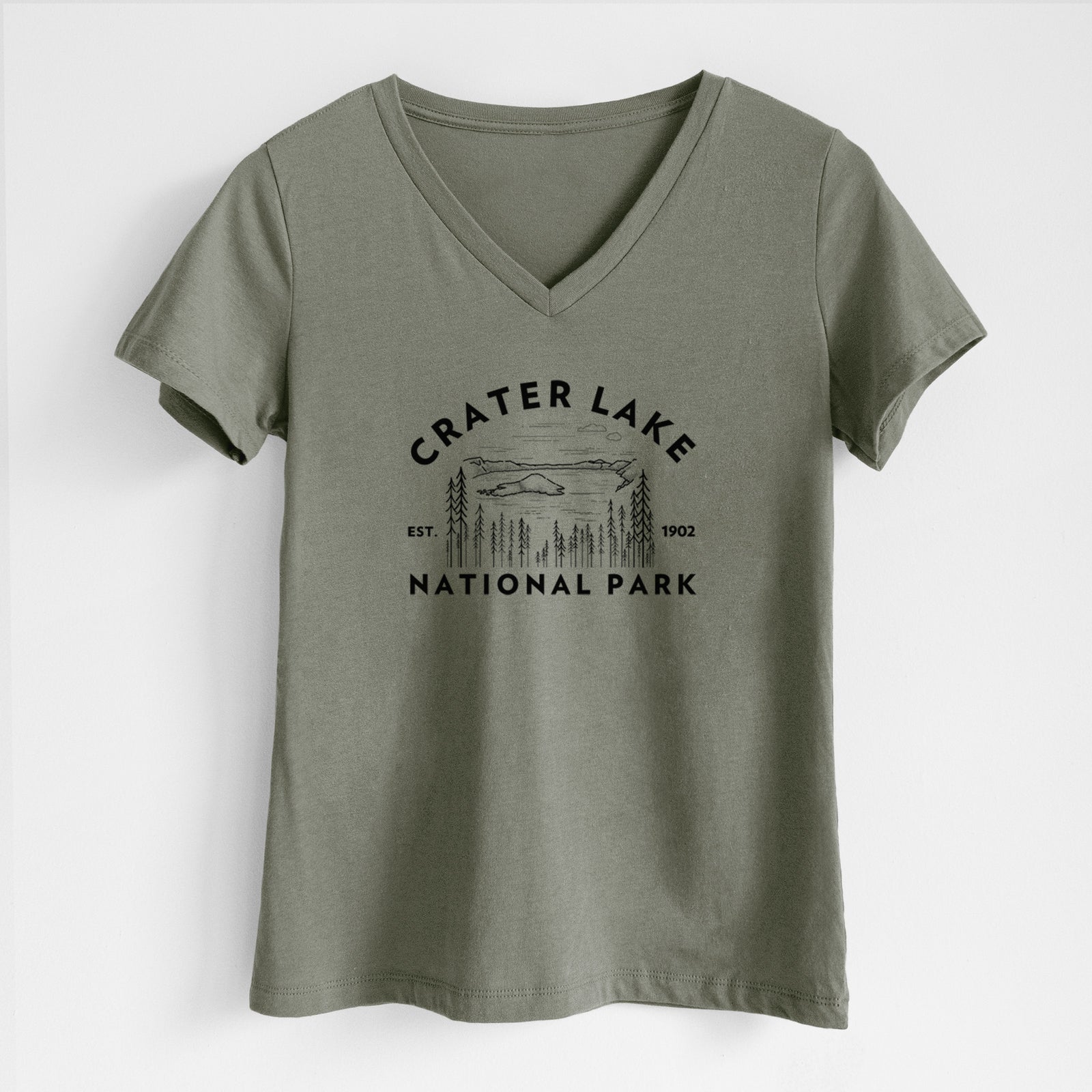 Military green women's relaxed fit cotton V-neck t-shirt laid flat, printed with a round badge of Crater Lake ringed by pine trees, with the words Crater Lake National Park, Est. 1902.