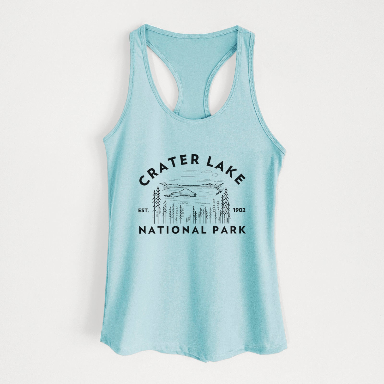 Banana cream women's racerback tank top laid flat, printed with a round badge of Crater Lake ringed by pine trees, with the words Crater Lake National Park, Est. 1902.