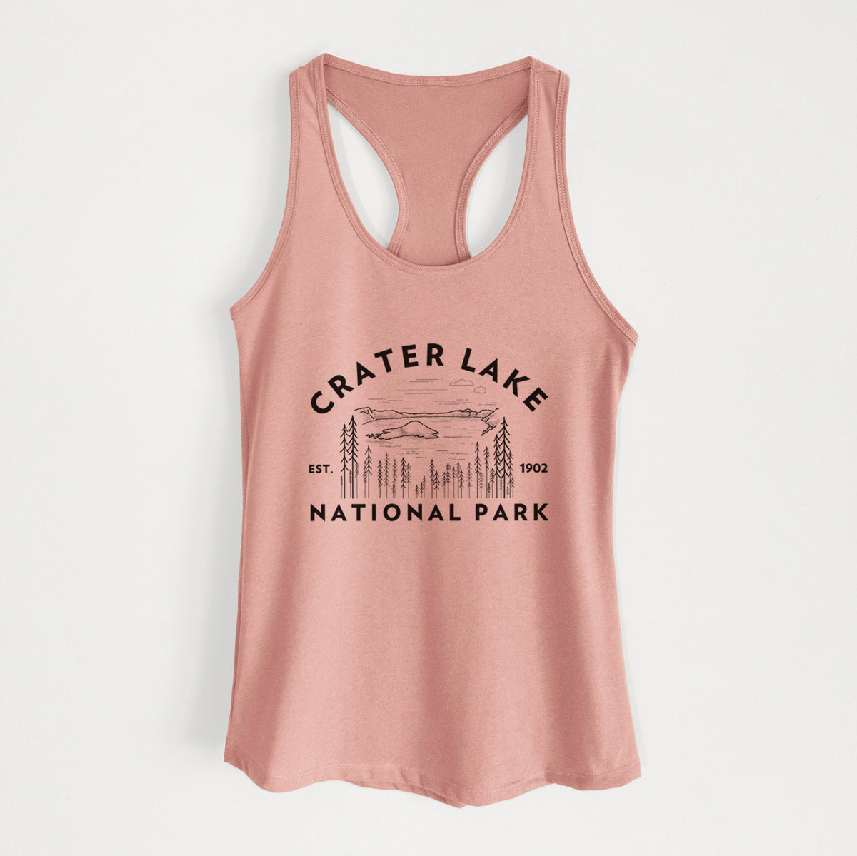Desert pink women's racerback tank top laid flat, printed with a round badge of Crater Lake ringed by pine trees, with the words Crater Lake National Park, Est. 1902.