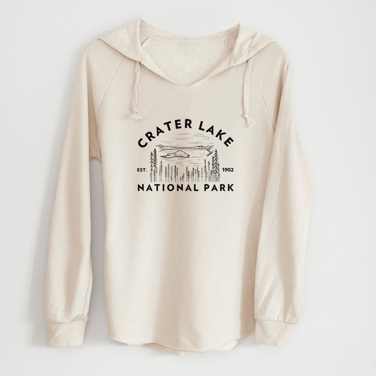 Bone cream women's Cali Wave hooded sweatshirt laid flat, printed with a round badge of Crater Lake ringed by pine trees, with the words Crater Lake National Park, Est. 1902.
