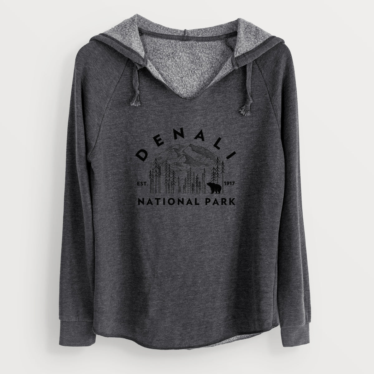 Charcoal grey women's Cali Wave hooded sweatshirt laid flat, printed with a round badge of mountains, pine trees and a bear, with the words Denali National Park, Est. 1917.