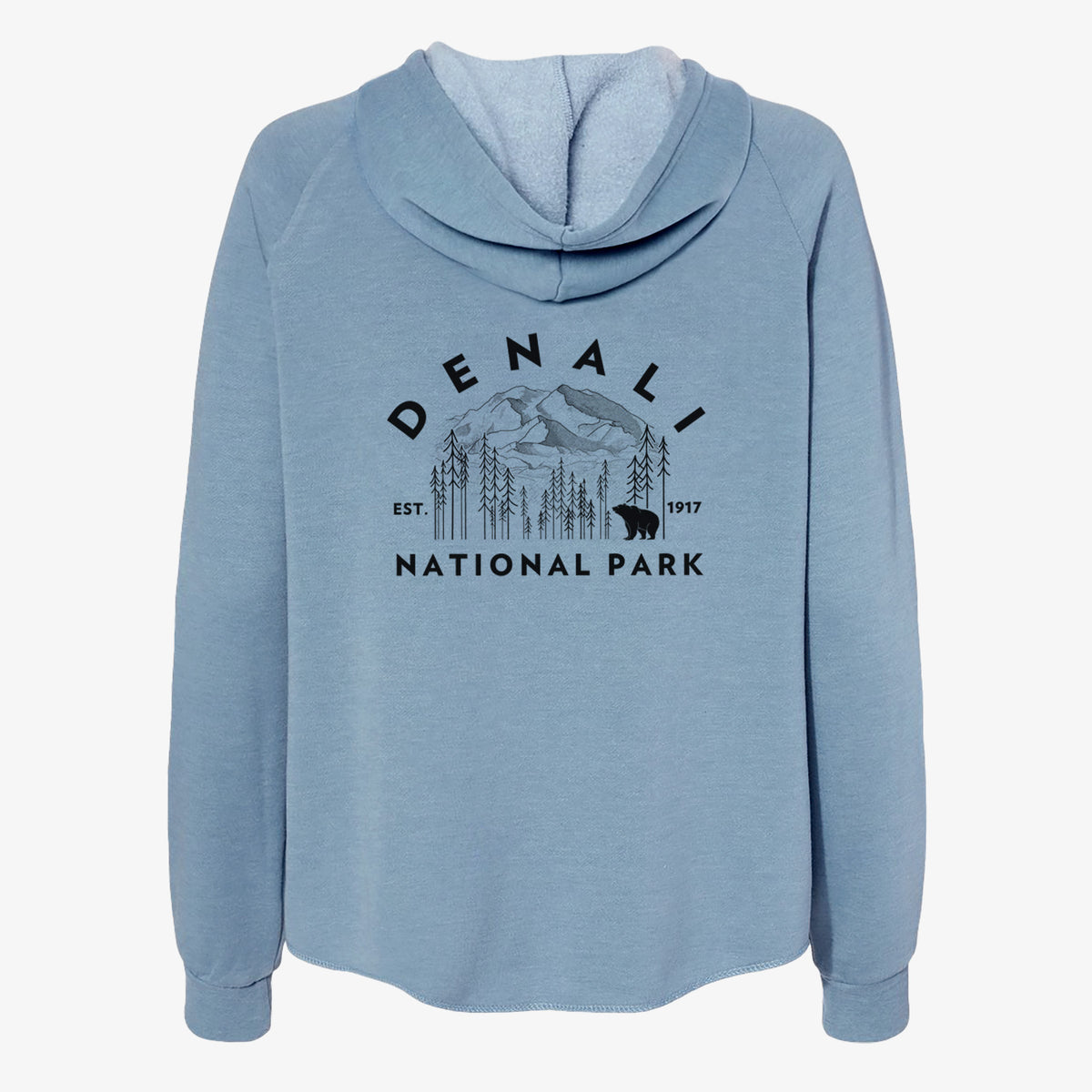 Misty blue women's Cali Wave zip-up sweatshirt laid flat, printed with a round badge of mountains, pine trees and a bear, with the words Denali National Park, Est. 1917.