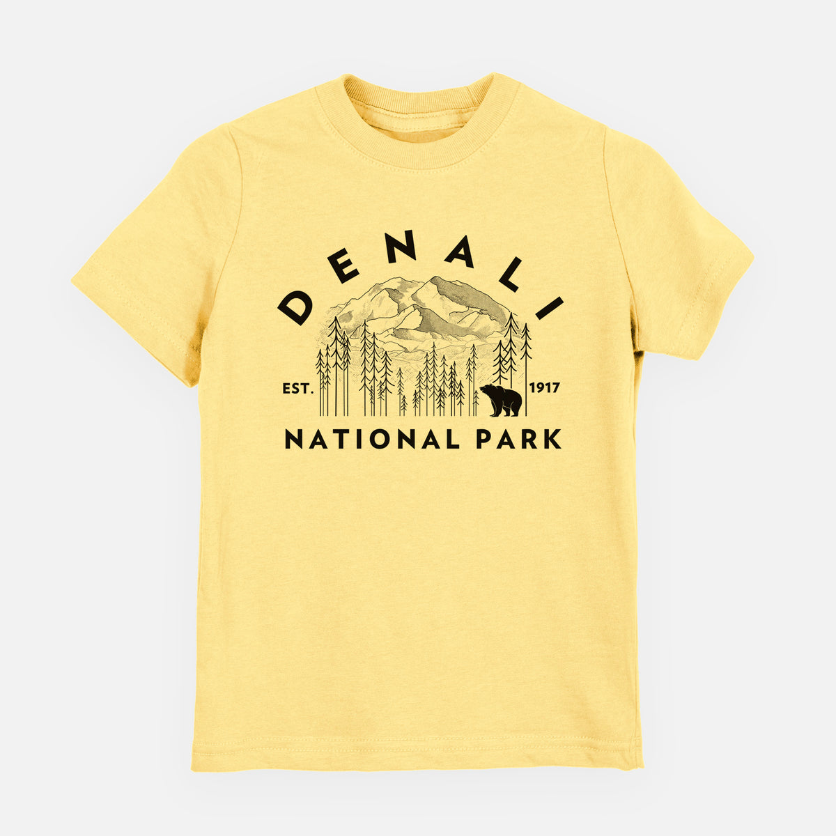 Butter yellow youth t-shirt laid flat, printed with a round badge of mountains, pine trees and a bear, with the words Denali National Park, Est. 1917.