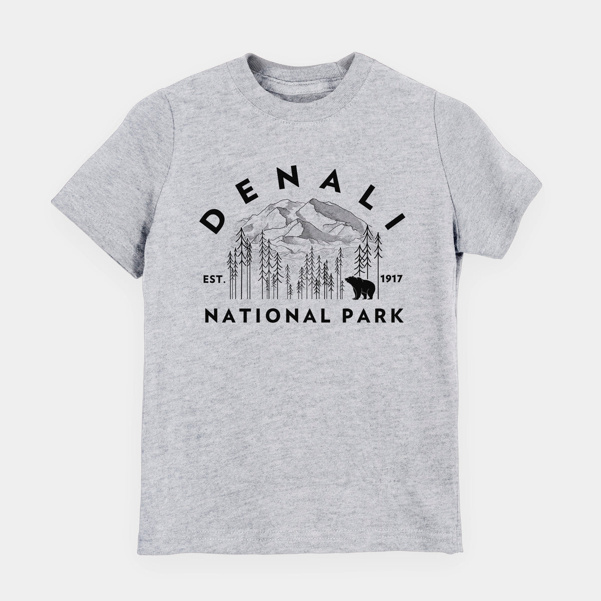 Heather grey youth t-shirt laid flat, printed with a round badge of mountains, pine trees and a bear, with the words Denali National Park, Est. 1917.