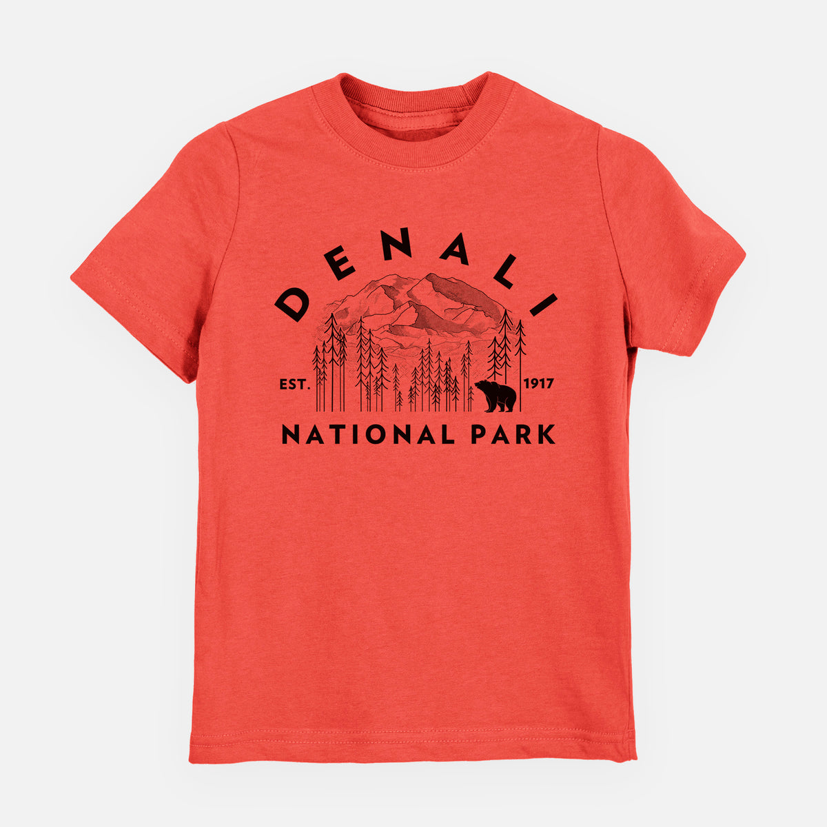 Passionfruit pink youth t-shirt laid flat, printed with a round badge of mountains, pine trees and a bear, with the words Denali National Park, Est. 1917.