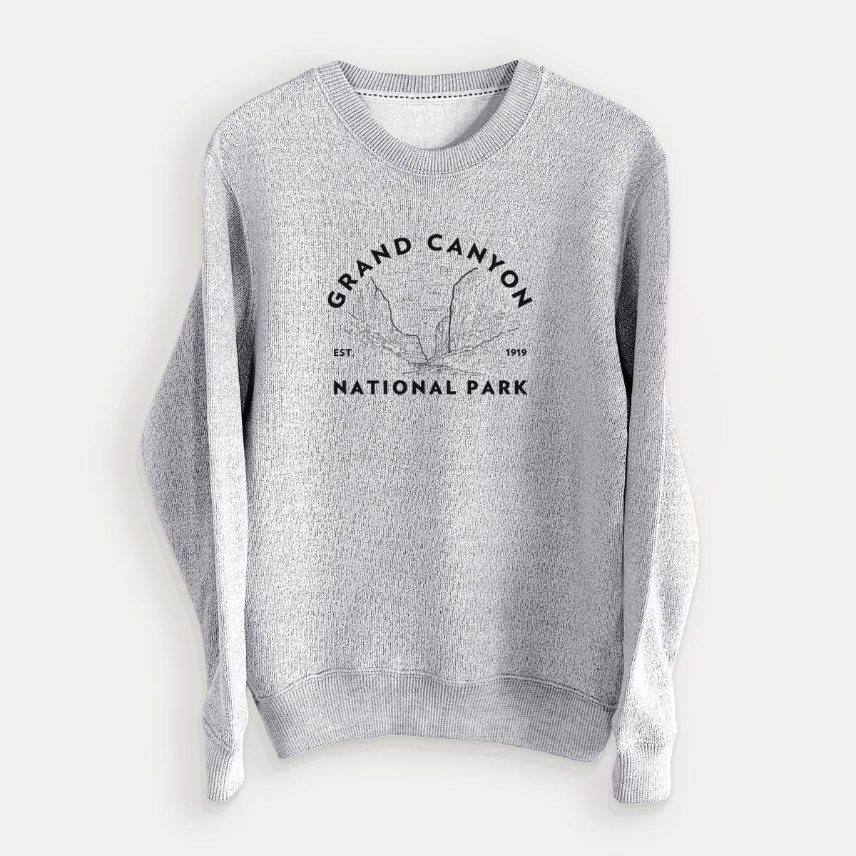Salt and pepper knit sweatshirt laid flat, printed with a round badge of canyon cliffs, with the words Grand Canyon National Park, Est. 1919.