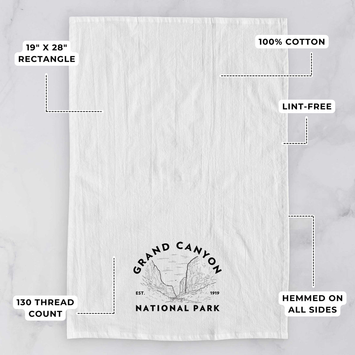 White tea towel printed with a round badge of canyon cliffs, with the words Grand Canyon National Park, Est. 1919, with feature labels: 19 by 28 inch rectangle, 100% cotton, lint-free, 130 thread count, hemmed on all sides.