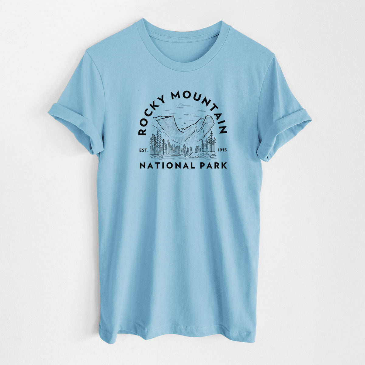 Ocean blue lightweight cotton t-shirt laid flat, printed with a round badge of mountains and pine trees, with the words Rocky Mountain National Park, Est. 1915.