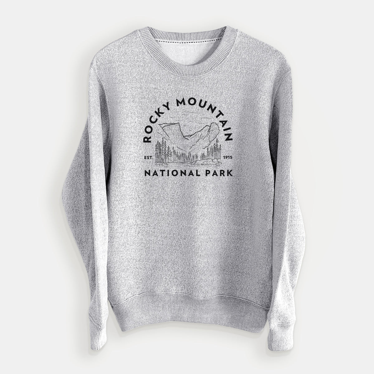 Salt and pepper knit sweatshirt laid flat, printed with a round badge of mountains and pine trees, with the words Rocky Mountain National Park, Est. 1915.