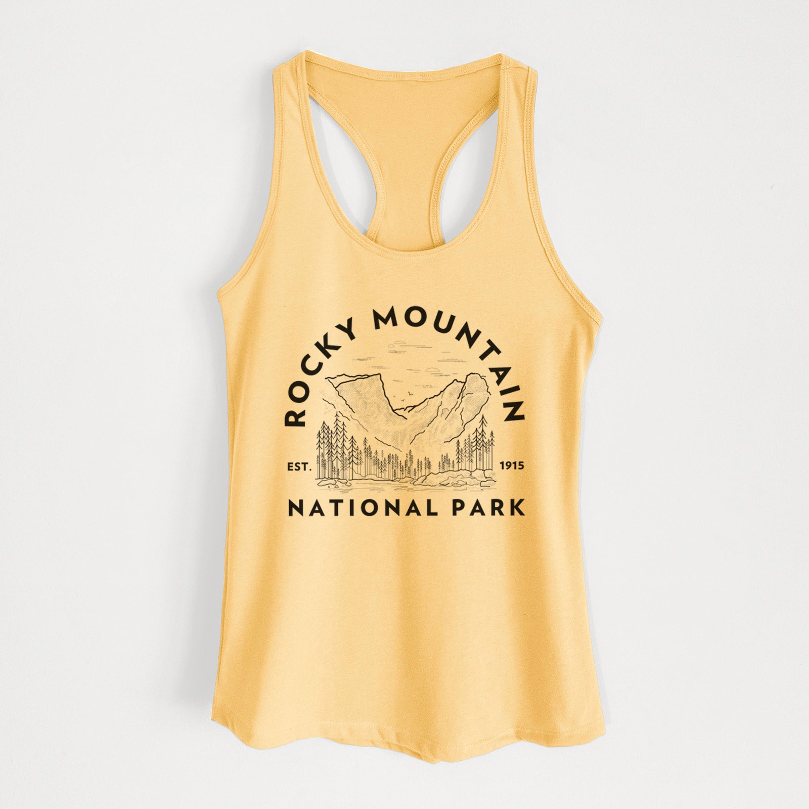 Banana cream women's racerback tank top laid flat, printed with a round badge of mountains and pine trees, with the words Rocky Mountain National Park, Est. 1915.