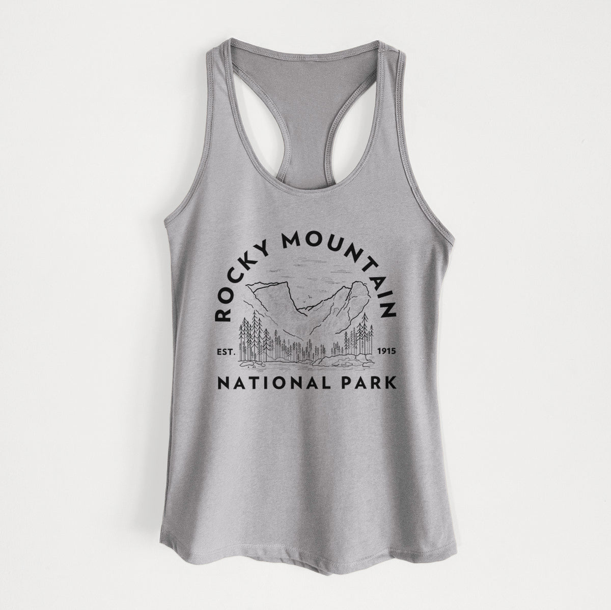 Heather grey women's racerback tank top laid flat, printed with a round badge of mountains and pine trees, with the words Rocky Mountain National Park, Est. 1915.