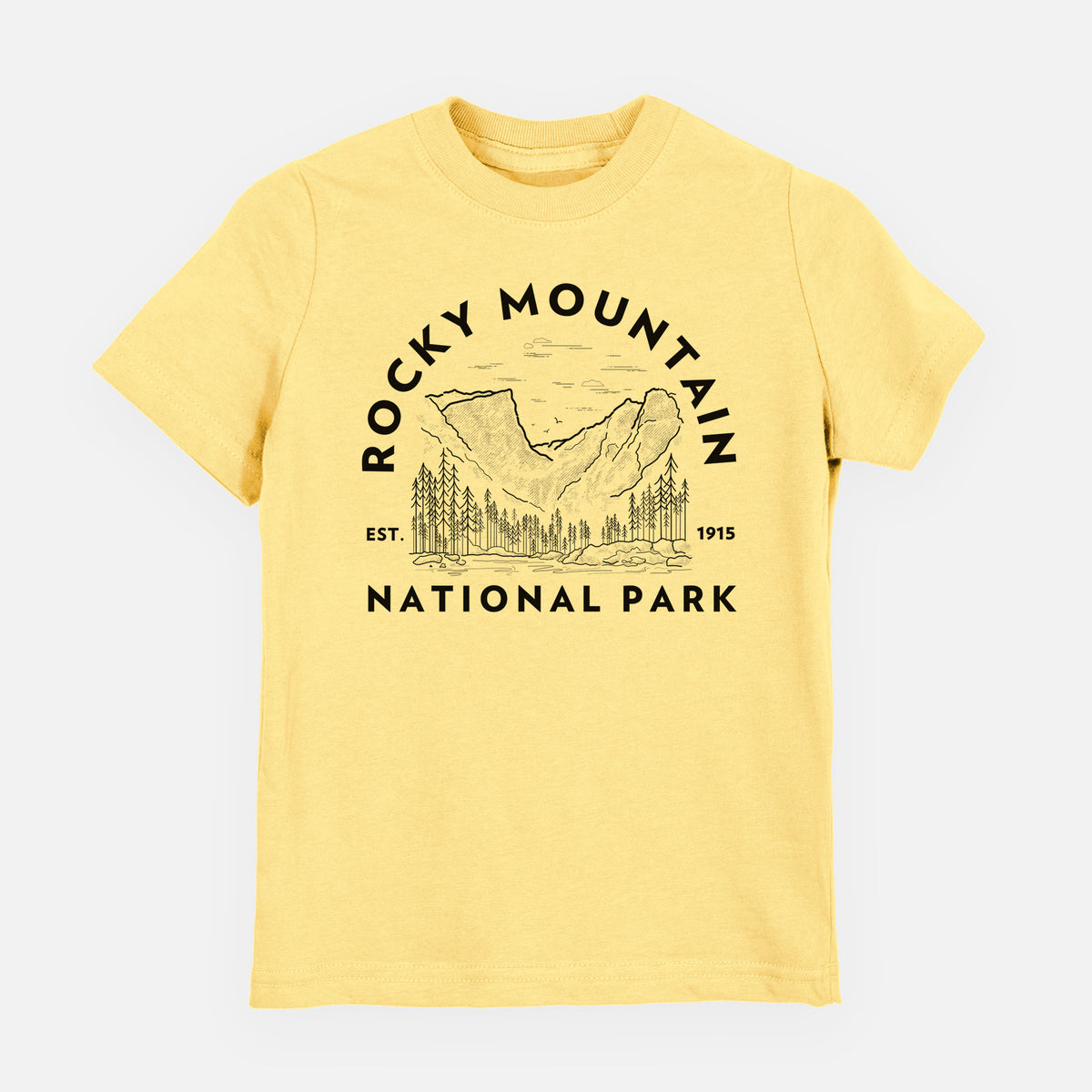 Butter yellow youth t-shirt laid flat, printed with a round badge of mountains and pine trees, with the words Rocky Mountain National Park, Est. 1915.
