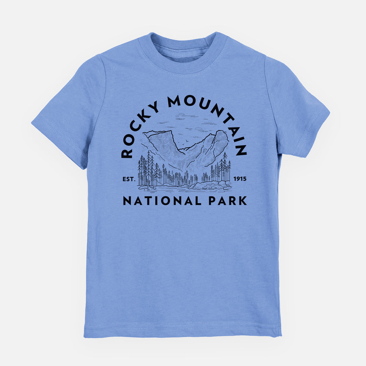 Carolina blue youth t-shirt laid flat, printed with a round badge of mountains and pine trees, with the words Rocky Mountain National Park, Est. 1915.