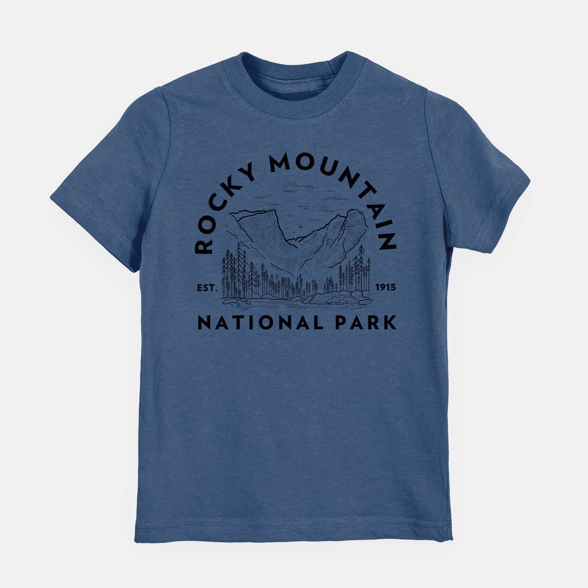 Indigo blue youth t-shirt laid flat, printed with a round badge of mountains and pine trees, with the words Rocky Mountain National Park, Est. 1915.