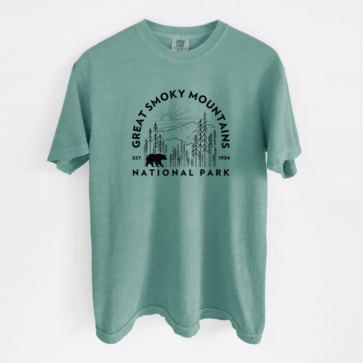 Reef green Comfort Colors t-shirt laid flat, printed with a round badge of mountains, pine trees and a black bear, with the words Great Smoky Mountains National Park, Est. 1934.