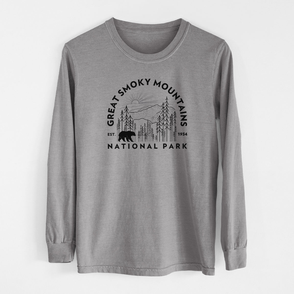 Grey Comfort Colors long sleeve shirt laid flat, printed with a round badge of mountains, pine trees and a black bear, with the words Great Smoky Mountains National Park, Est. 1934.