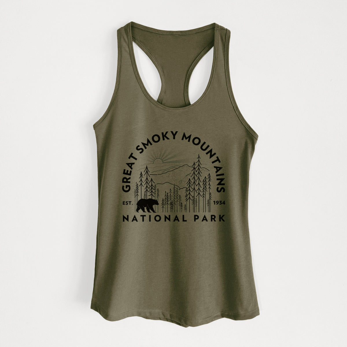 Military green women's racerback tank top laid flat, printed with a round badge of mountains, pine trees and a black bear, with the words Great Smoky Mountains National Park, Est. 1934.