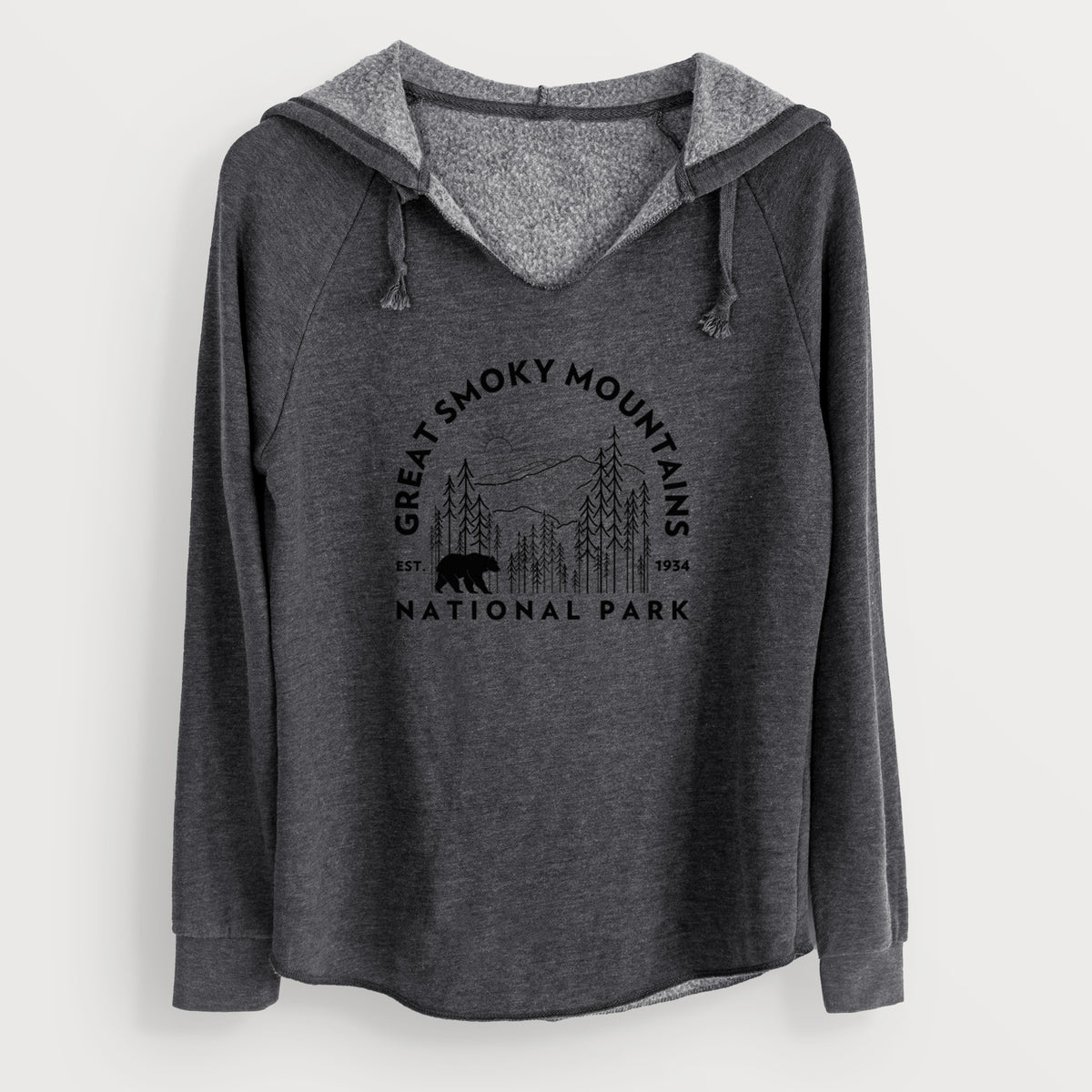 Charcoal grey women's Cali Wave hooded sweatshirt laid flat, printed with a round badge of mountains, pine trees and a black bear, with the words Great Smoky Mountains National Park, Est. 1934.