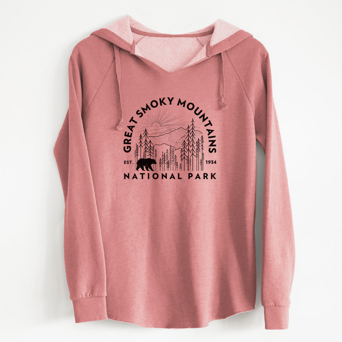 Dusty rose women's Cali Wave hooded sweatshirt laid flat, printed with a round badge of mountains, pine trees and a black bear, with the words Great Smoky Mountains National Park, Est. 1934.