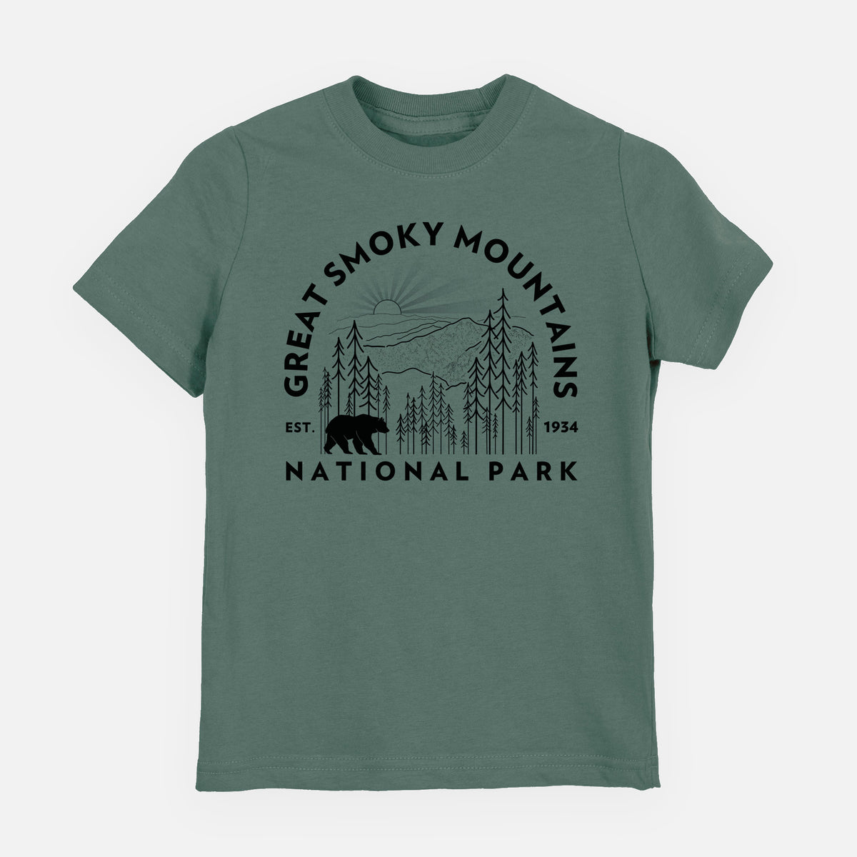 Basil green youth t-shirt laid flat, printed with a round badge of mountains, pine trees and a black bear, with the words Great Smoky Mountains National Park, Est. 1934.