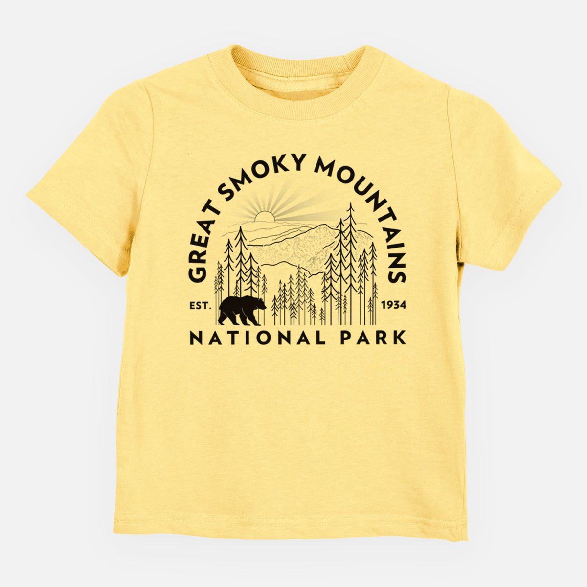 Butter yellow toddler t-shirt laid flat, printed with a round badge of mountains, pine trees and a black bear, with the words Great Smoky Mountains National Park, Est. 1934.