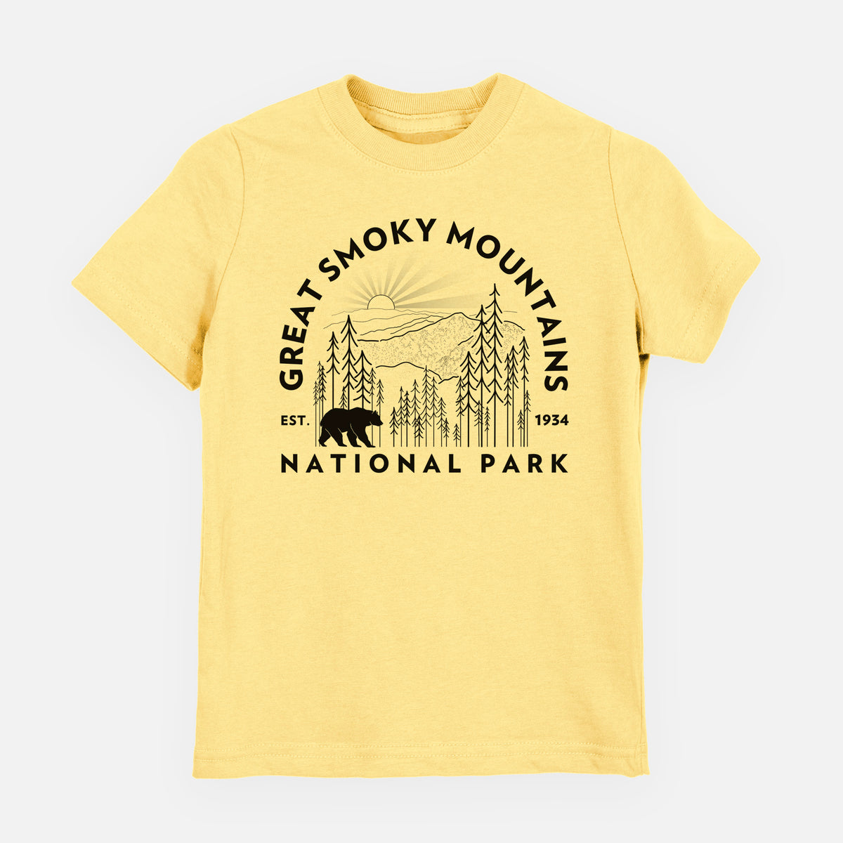 Butter yellow youth t-shirt laid flat, printed with a round badge of mountains, pine trees and a black bear, with the words Great Smoky Mountains National Park, Est. 1934.